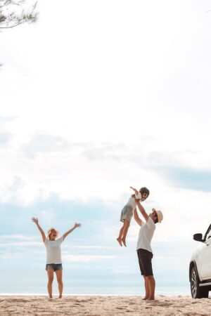 Happy Family with car travel road trip. summer vacation in car in the sunset, Dad, mom and daughter happy traveling enjoy together driving in holidays, people lifestyle ride by automobile.